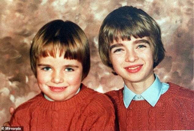 Liam and Noel smiling together as children in matching knitted jumpers