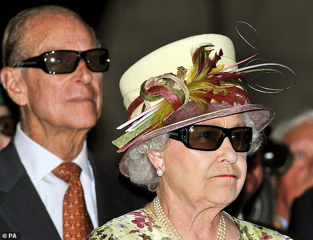 Queen Elizabeth II and the Duke of Edinburgh watch a 3D film at the Pinewood Studios in Toronto, Canada, in 2010