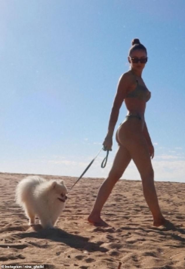 Nina Ghaibi, 24, is also not shy to show off her picturesque life, which includes walking her Pomeranian on a Moroccan beach in a bikini