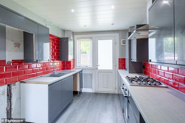 Vibrant: The house in Dundee has a vibrant kitchen with red tiles