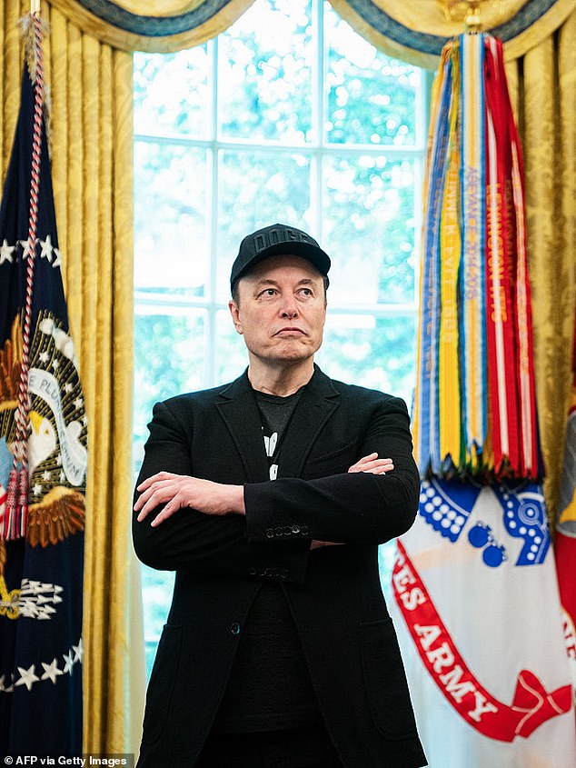 Elon Musk looks on during a news conference with US President Donald Trump in the Oval Office of the White House in Washington, DC, on May 30, 2025. Musk, who stormed into US politics as President Trump's chainsaw-brandishing sidekick, announced on May 28 that he is leaving his role in US government, intended to reduce federal spending, shortly after his first major break with the President over Trump's signature spending bill