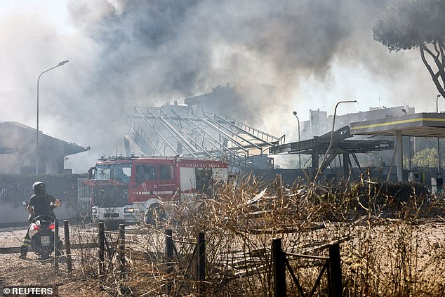 A huge cloud of smoke rises after a gas station exploded on the outskirts of Rome, Italy, July 4, 2025