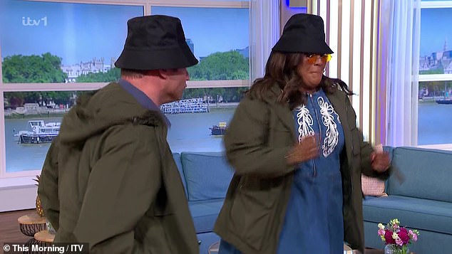 Both wore black bucket hats and green coats, while Alison donned small, round sunglasses, mimicking Liam and Noel