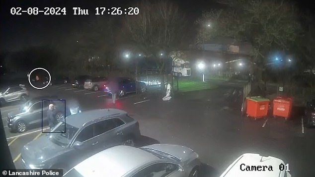 A man, wearing orange hi-vis, could be seen loitering nearby, seemingly waiting for someone