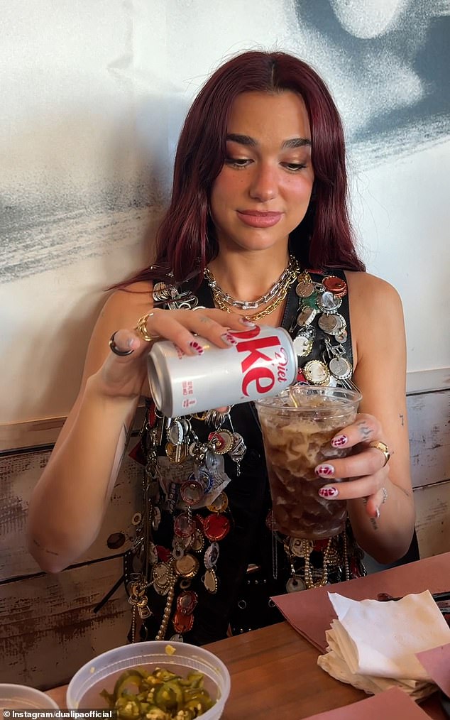 Taking to TikTok to share the strange combination she began: 'Step one, diet coke and then pickle juice, then a couple of pickles'