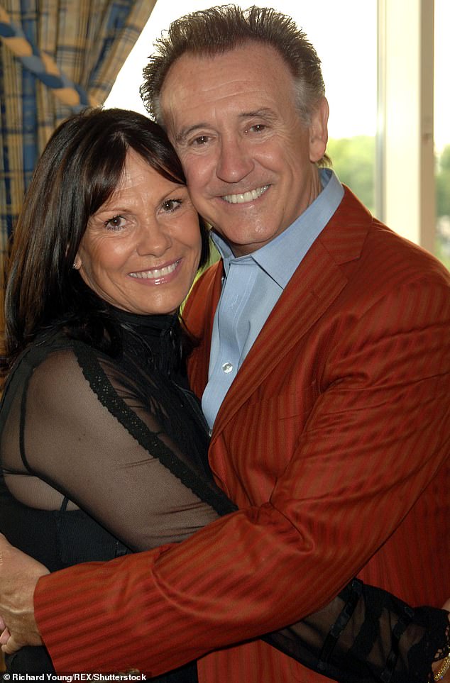 Tony said: 'Suddenly, I was having problems doing them, and my wife (pictured) said "Let's go and see a doctor"'