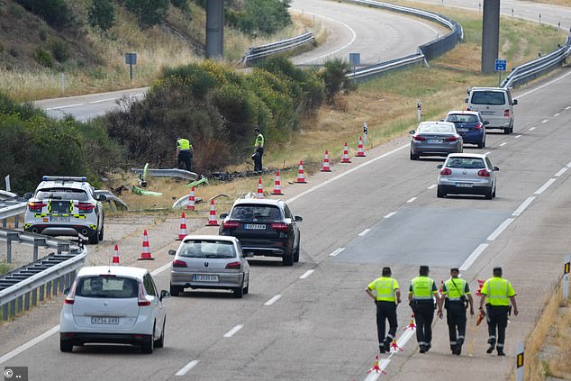 Investigators at the scene of the crash near Zamora, Spain today