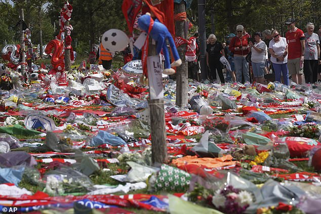 Football fans leave tributes in memory of Liverpool player Diogo Jota at Anfield Stadium, home of Liverpool FC
