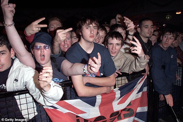 From sweaty pub gigs, sold-out stadiums to swooning fans the snaps capture every glorious, chaotic moment