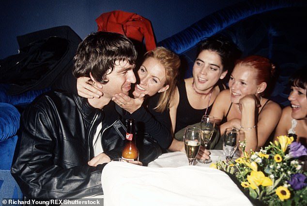 Another throwback shows Noel and his then wife Meg Mathews with models Kate Moss and Lisa Walker swooning over him