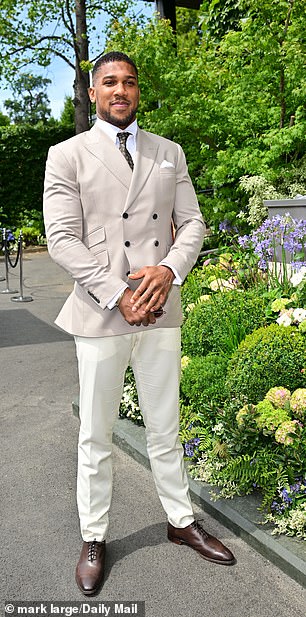 Joshua posed for the Daily Mail's photographer in his double button-up suit