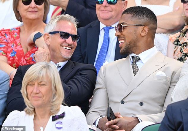 Joshua (right) found himself sat next to former Match of the Day presenter Gary Lineker (left)