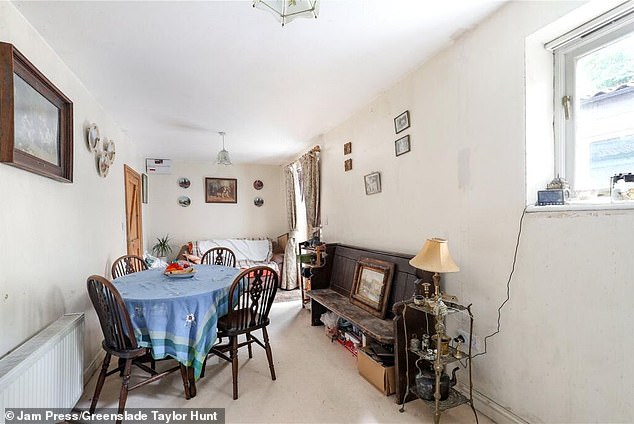 Set across three floors, the main property is full of character, with wooden beams, exposed brickwork, and large windows flooding it in natural light