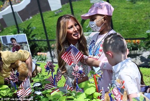 The first lady helped the children at Children's National Hospital decorate a healing garden for the Fourth of July