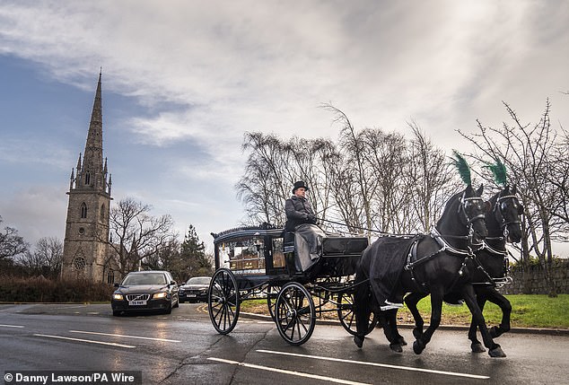 A horse-drawn carriage carrying the coffin of The Vivienne at St Margaret's Church, Bodelwyddan, Denbighshire, on January 27