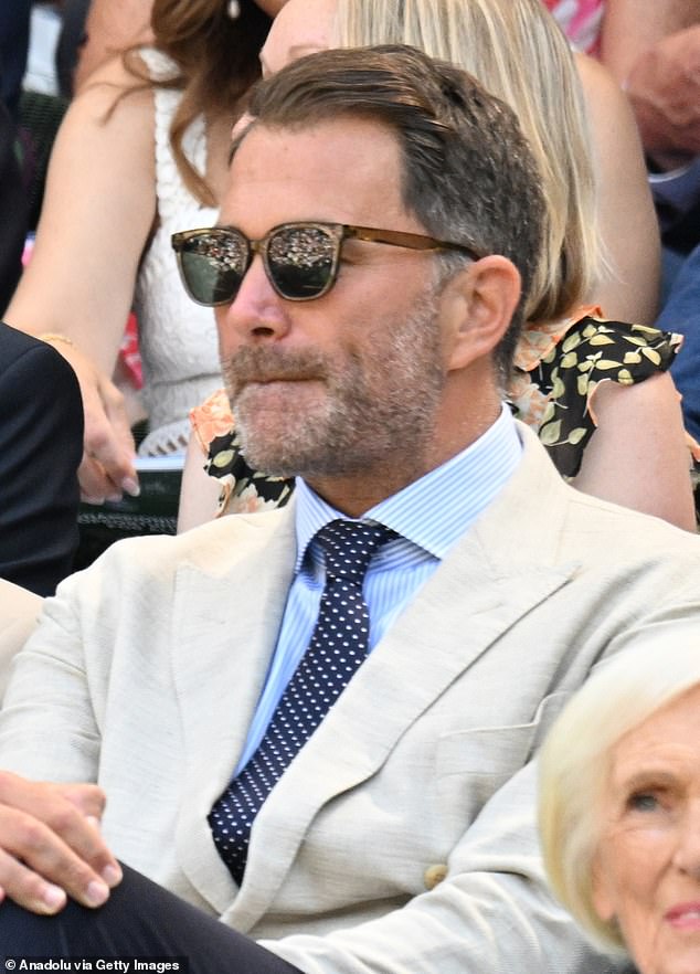 Boxing promoter Eddie Hearn, 46, was suited and booted in a beige jacket and blue shirt paired with a navy tie