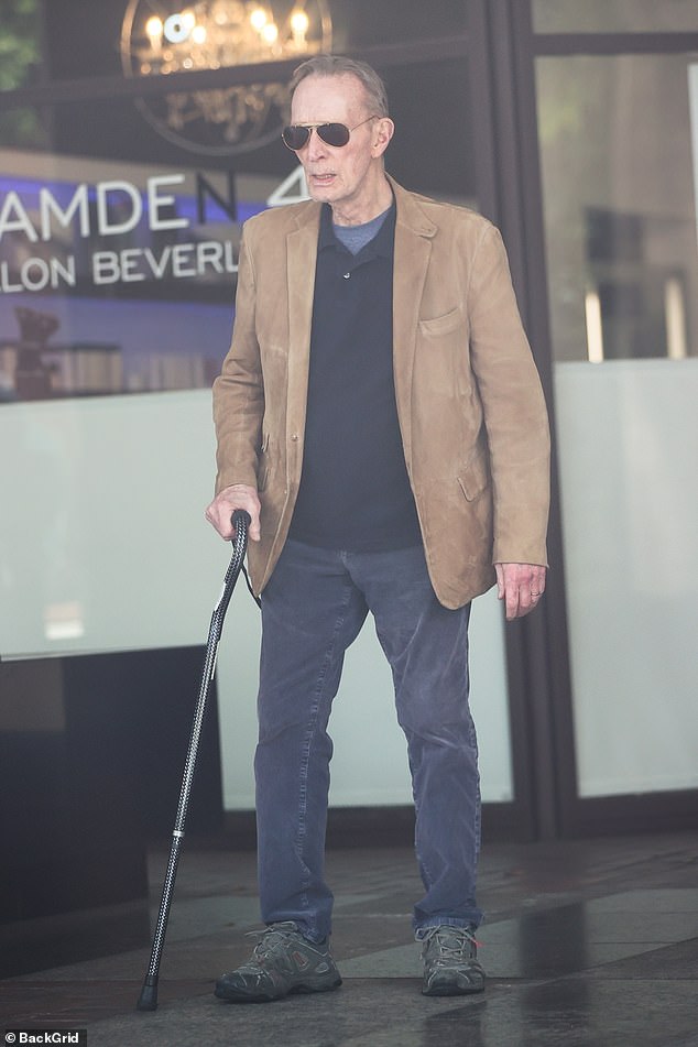 Ted Shackelford, 79, enjoyed his Friday wandering around Beverly Hills near Rodeo Drive, running errands and looking sleek in his light brown suede blazer over a dark blue-collar shirt layered over a gray undershirt
