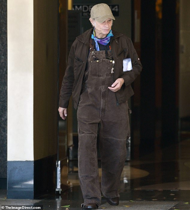 Roth additionally wore a light green cap on top of his head and loosely tied a colorful handkerchief around his neck