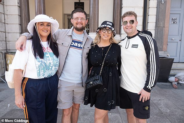 Oasis fans were all smiles as they posed ahead of the first show in Cardiff