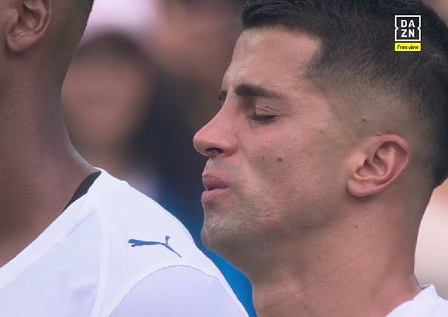 Cancelo could be seen fighting back the tears as players gathered around the centre circle