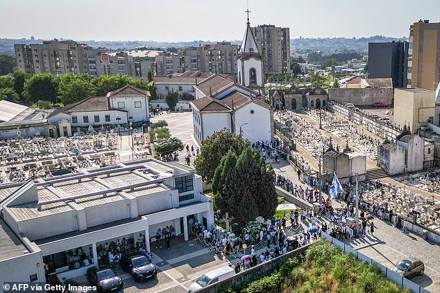 An aerial view shows the line of mourners snaking from the chapel to the church (top, middle of shot) where Jota's funeral will be held tomorrow