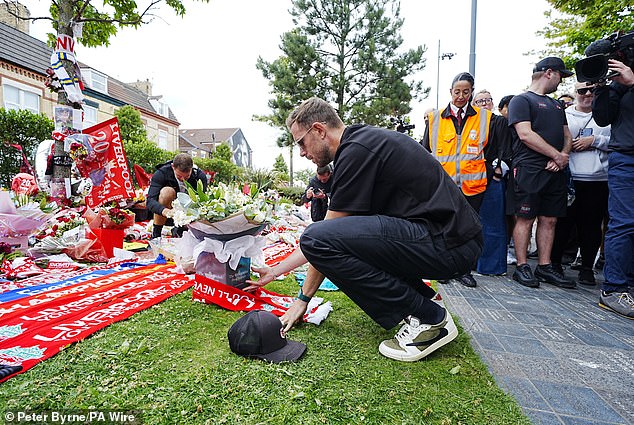 He laid flowers and a Liverpool scarf in memory of his old team-mate who died on Thursday