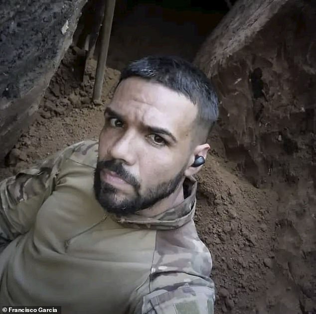 Francisco Garcia, a Cuban who was duped and enlisted into the Russian army, wearing his military fatigues on the frontlines