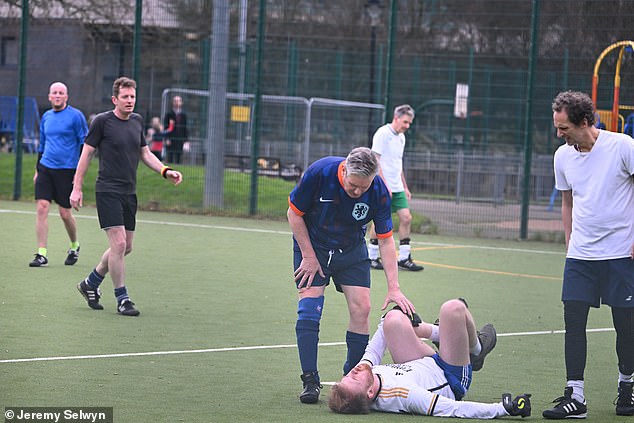 When host Nick Robinson revealed that a former football team-mate had described Sir Keir as a ‘hard bastard’, the PM responded: ‘I’m a hard-enough bastard to find out who said that so I can have a discussion with them’ Pictured: Sir Keir checking-in on an injured player during one of his regular games of five-a-side