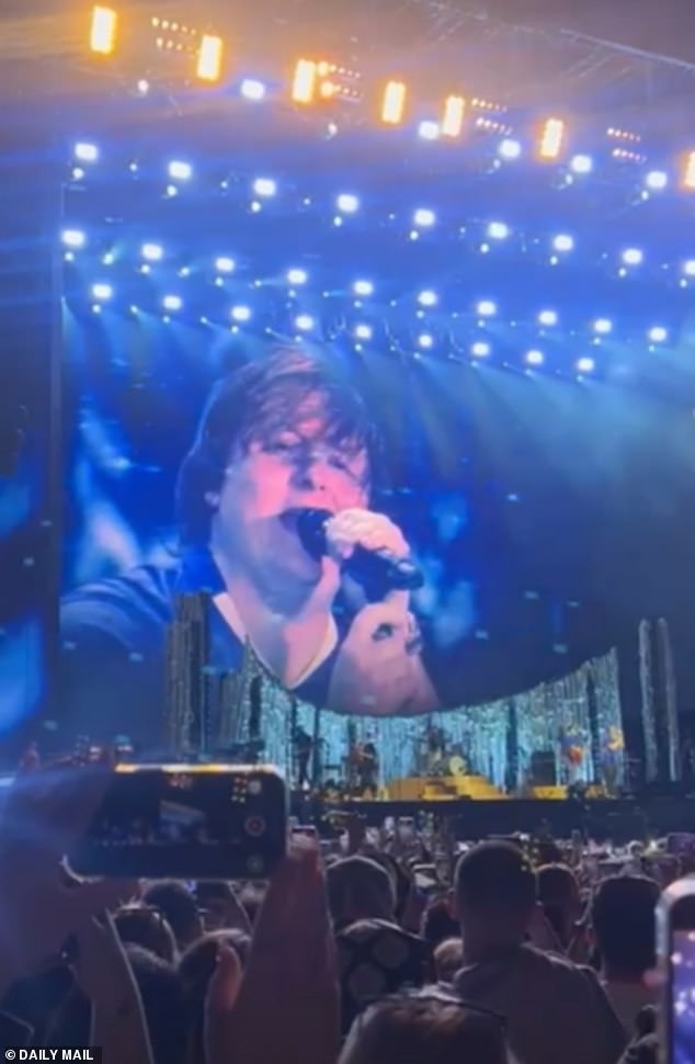 The lights went dark before a mystery guest was seen running on to the stage. And as the second verse began, the lights went up to reveal Lewis, with the fans going wild