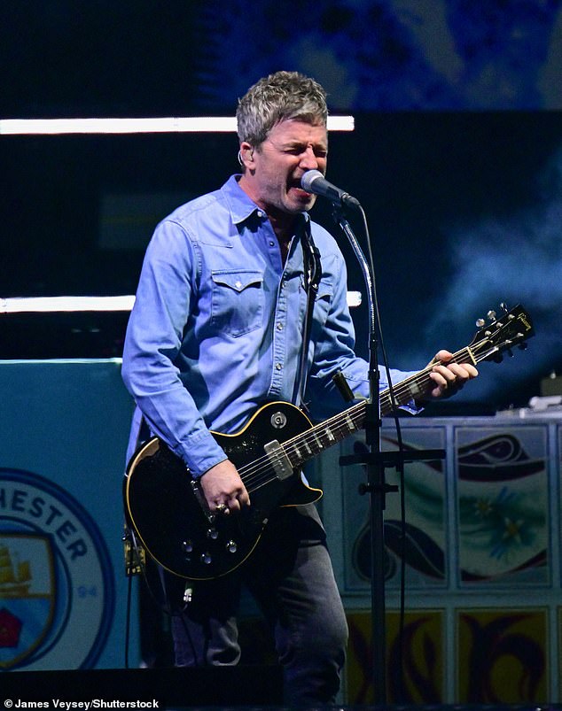 Noel wore a denim blue shirt with dark jeans as they performed major hits including Morning Glory and Acquiesce