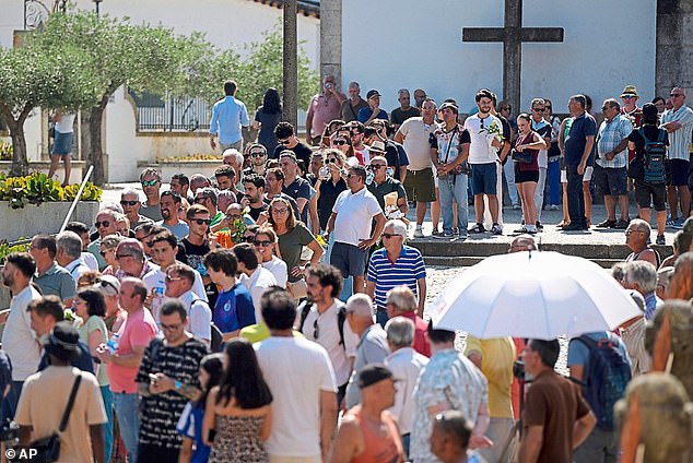A huge number of locals and travelling fans waited patiently to enter the chapel and say their farewells