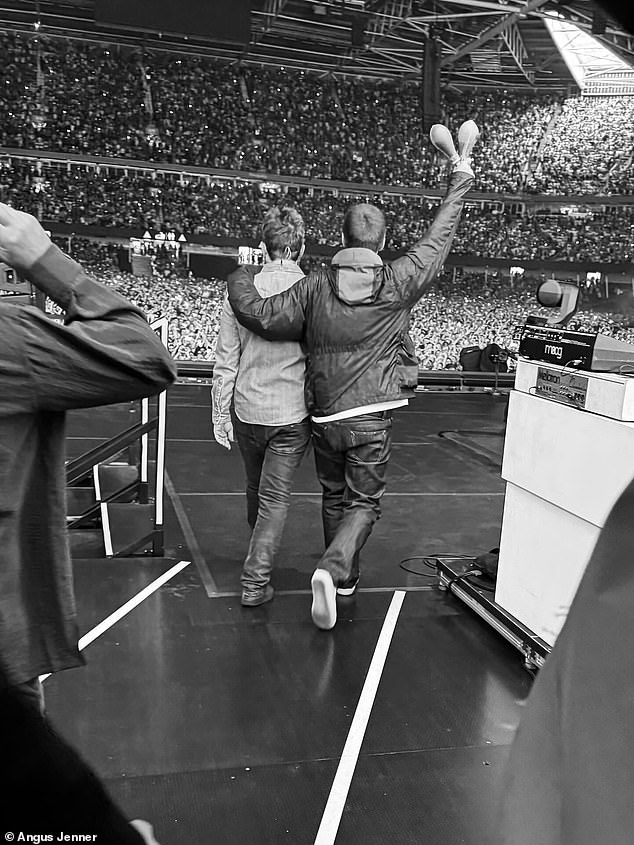 Before kicking off the show, Oasis' official Instagram page were quick to post a snap of the duo walking out to the crowd with Liam's arm around Noel's shoulders
