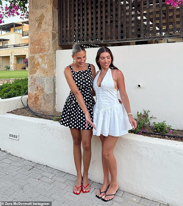 She too posed for a photo with her friend, with the pair pictured in great spirits as they stood arm-in-arm cracking beaming smiles for the camera
