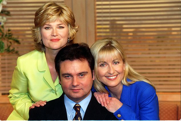 Anthea Turner, Eamon Holmes and Fiona pose for a photo on the set of GMTV