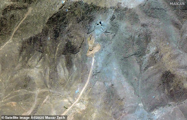 Excavators are seen at tunnel entrances at the Fordow nuclear site in Iran several days after the U.S. used the B-2 bombers and 'bunker buster' bombs to try and kill Iran's nuclear program amid the conflict with Israel