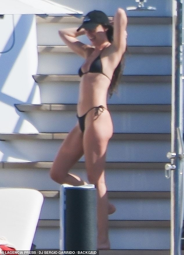 Dakota turned heads wearing a skimpy black bikini top as well as matching drawstring bottoms