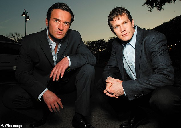 Dylan Walsh (right), who along with Julian (left) was one of the two lead characters Nip/Tuck, shared his reaction to his old colleague's death; they are pictured on the show in 2003