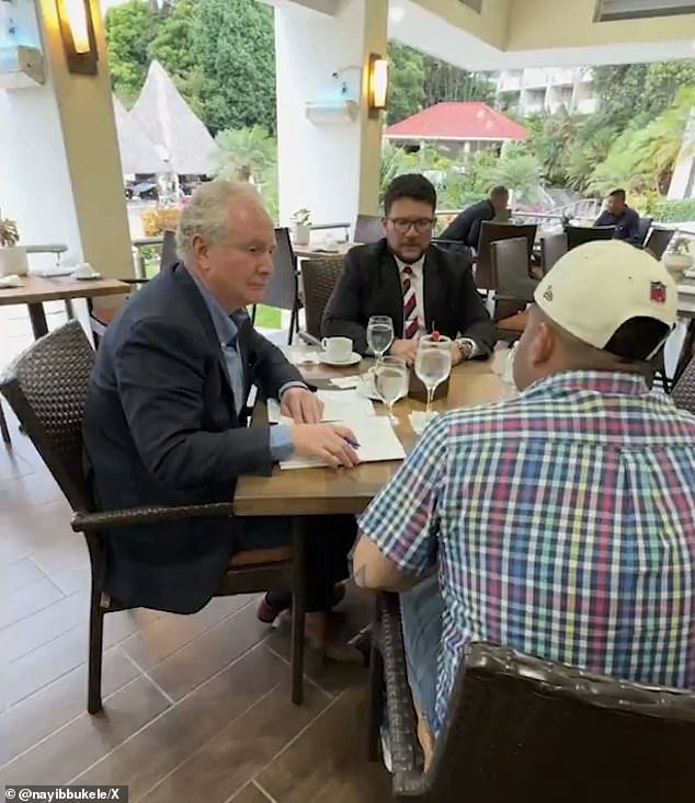 In an additional clip from a mid-April meeting with Senator Chris Van Hollen (left), Garcia (right in plaid) is seen enjoying cocktails