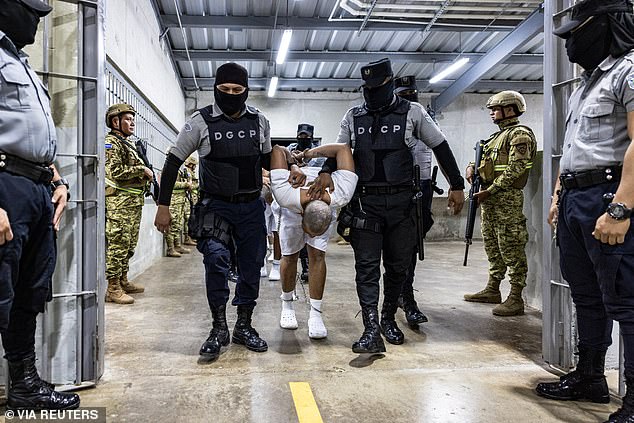 In his suit, Garcia described losing more than 30 pounds within two weeks at CECOT, citing overcrowded cells, inmate violence, and threats from guards. Pictured: San Salvador forces took heavy security measures inside the CECOT facility