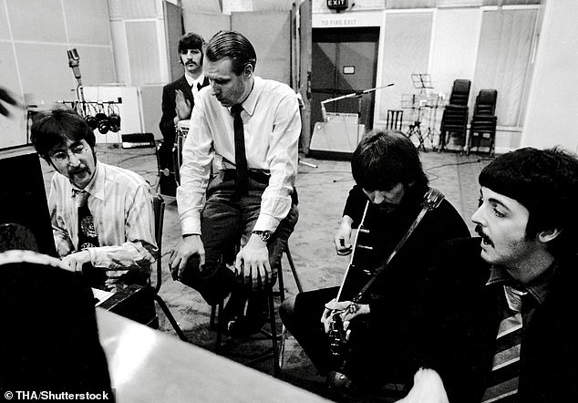 The Beatles and Sir George at Abbey Road Studios during a recording session for Sgt. Pepper's Lonely Hearts Club Band in 1967