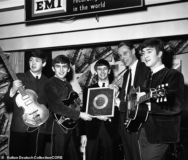 The Beatles and Sir George after they were awarded a silver disc for selling a quarter of a million copies of the single Please Please Me
