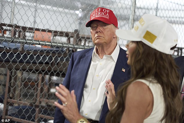 President Donald Trump listens as Homeland Security Secretary Kristi Noem speaks during a tour of "Alligator Alcatraz on Tuesday