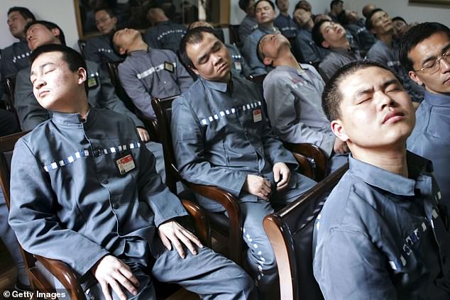 Inmates receive a psychological correctional treatment during a psychological training and consultation session at Qingpu Prison on April 8, 2005 in Shanghai, China