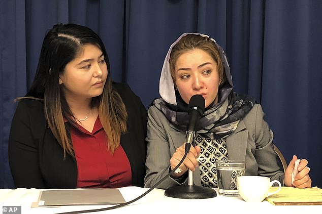 Mihrigul Tursun, right, speaks at a event at the National Press Club in Washington, Monday, Nov. 26, 2018. Tursun, a member of China's Uighur minority spoke of the torture and abuse she suffered at the hands Chinese authorities as part of an escalating clampdown on hundreds of thousands of members of the country's Muslim minorities