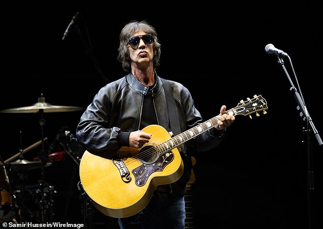 In a clip shared to TikTok as former The Verve frontman (pictured) performed the track and thousands sang along, the concert goer turned to her phone in order to identify the tune