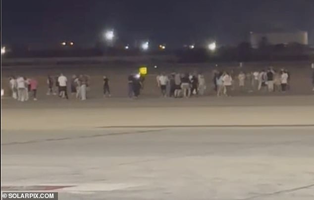 Passengers rushed to evacuate the plane, with six needing to be taken to hospital for treatment