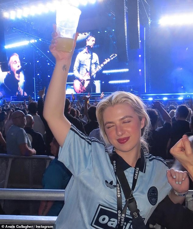 She had the time of her life as she raised her drink in the air while her dad Noel and uncle Liam performed
