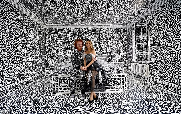 British artist Sam Cox, aka Mr Doodle, with his wife Alena, at a 12-room mansion he decorated with his artwork