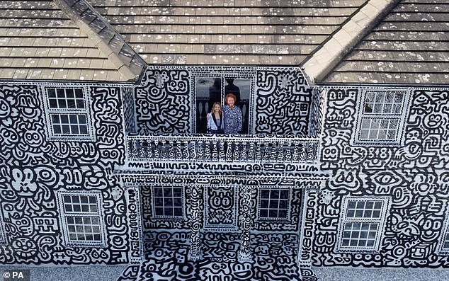 British artist Sam Cox, aka Mr Doodle, with his wife Alena, reveals the Doodle House in 2022 - a twelve-room mansion in Tenterden, in Kent