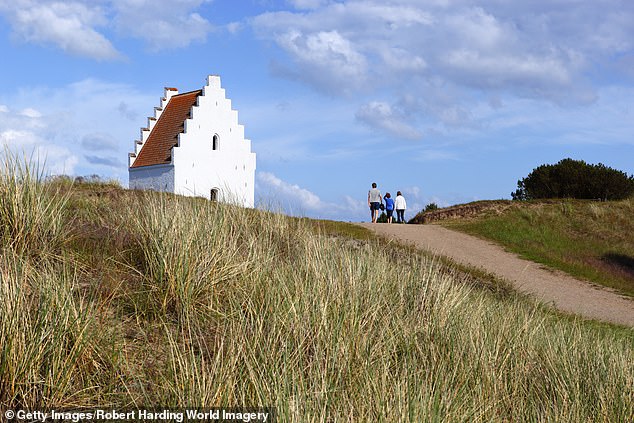 Tilsandede Kirke rises above the dunes close to Lønstrup in Denmark